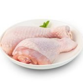 Raw chicken leg(drumstick) in white plate isolated on white background with Clipping Path